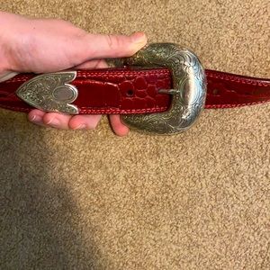 Ariat red belt with silver buckle fits sizes 26-28 waist. READ DESCRIPTION